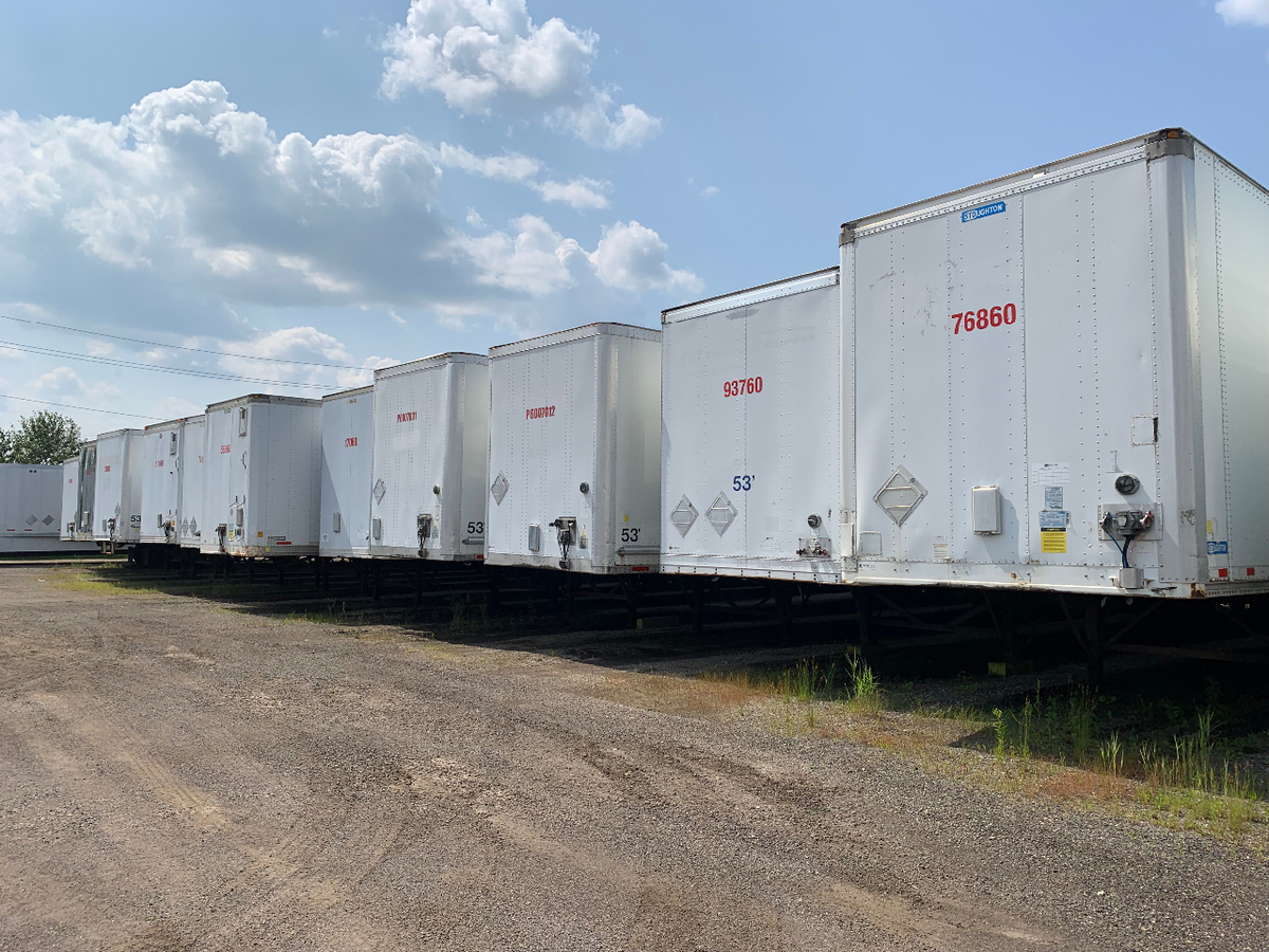 A high-angle photo of trucks in a parking lot